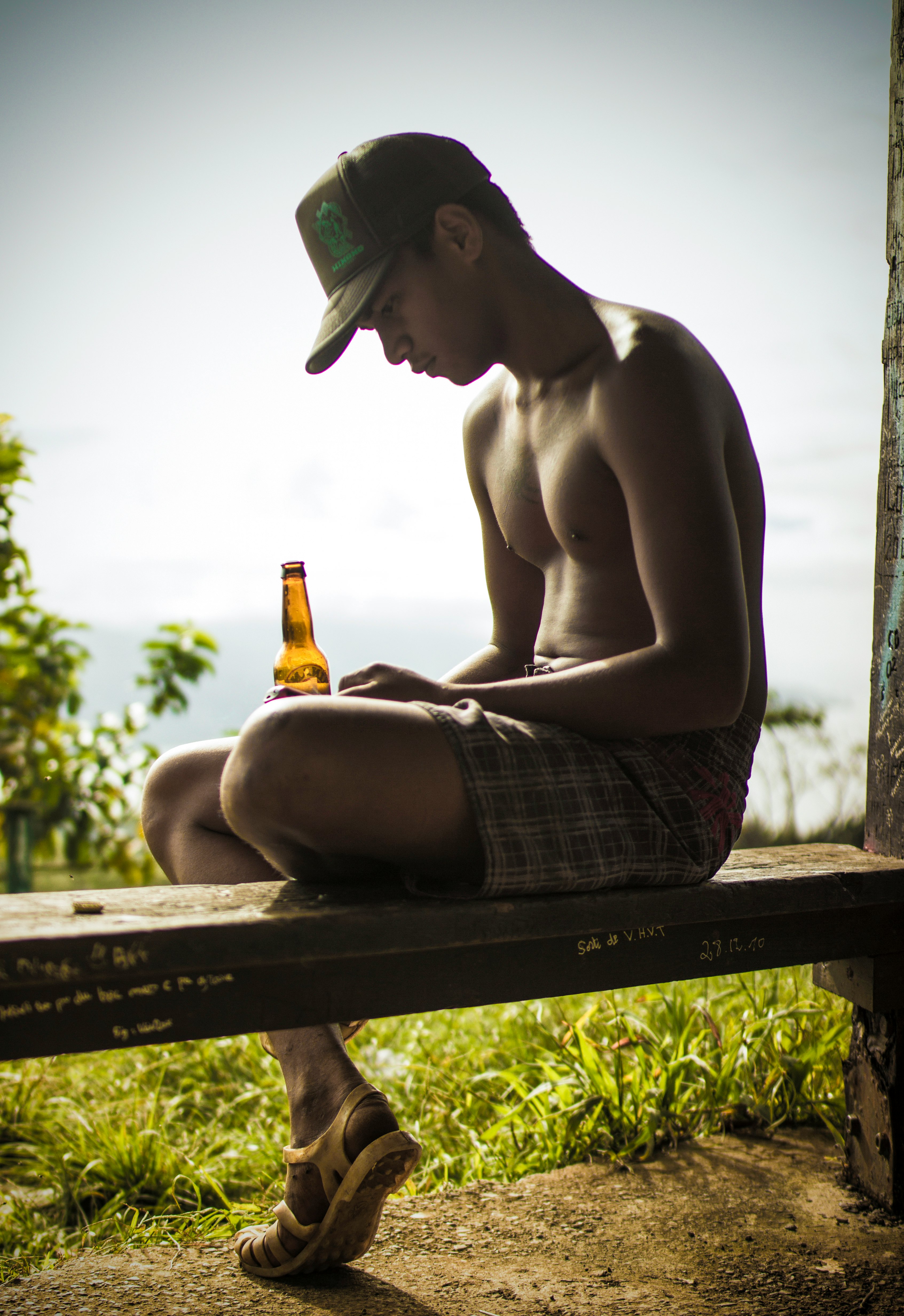 topless man sitting down